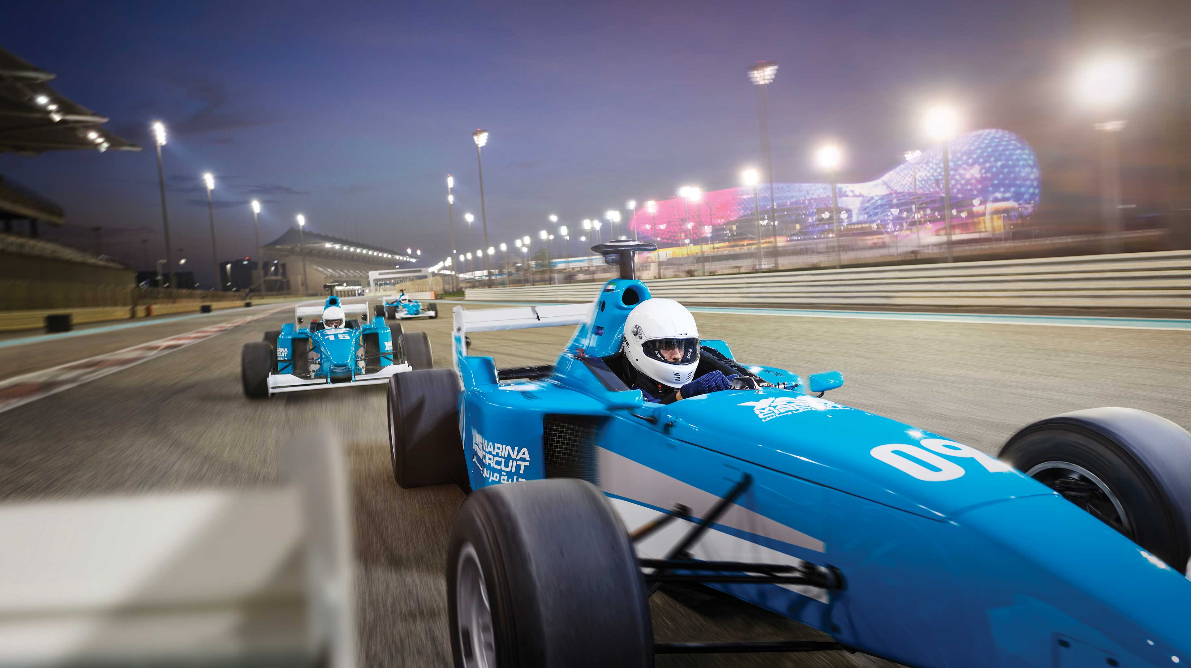 Blue racecars on the track at Yas Marina Circuit