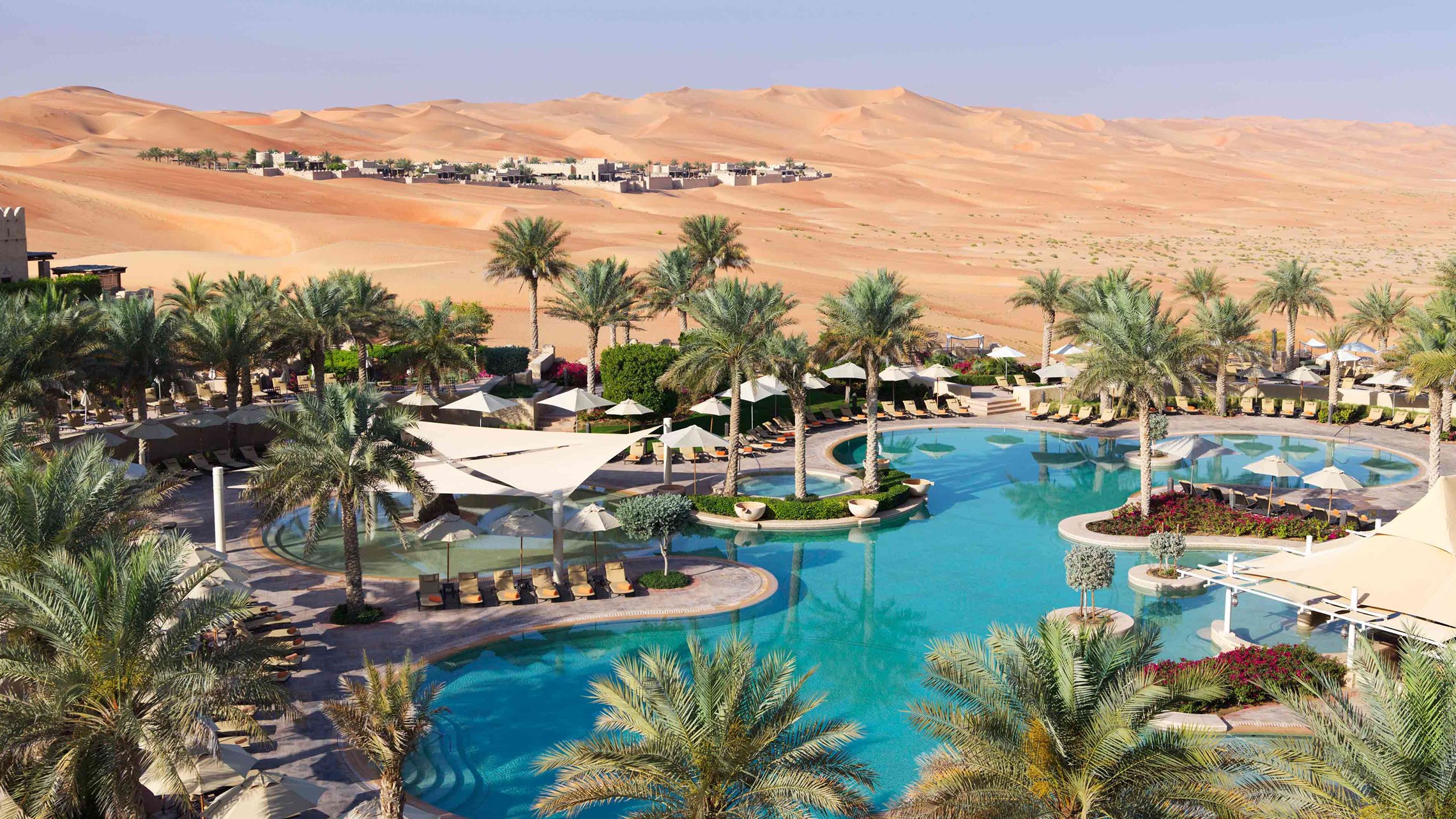 The swimming pool at Qasr Al Sarab Desert Resort by Anantara